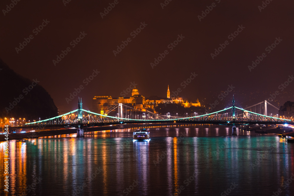 Buda Castle and Liberty bridge illuminated at night. Night skyline of Budapest. Hungary 