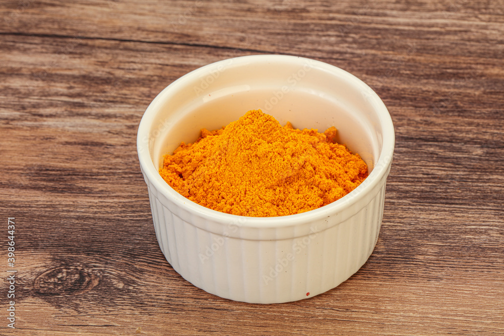 Tumeric powder in the bowl Tumeric powder in the bowl