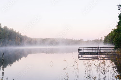 Foggy lake at sunrise in autumn