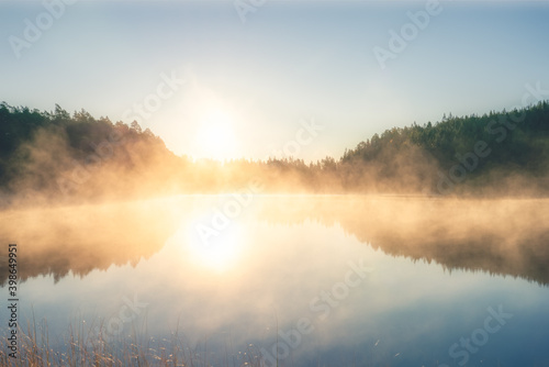 Sunrsise at the lake with morning fog © Pawel Pajor