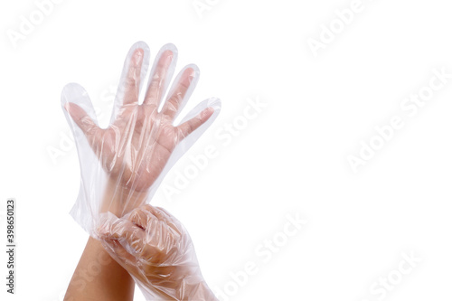 Women hand wearing plastic gloves, Multipurpose disposable gloves, Sanitary food contact gloves isolated on white background. The concept is Smart way to protect hands 