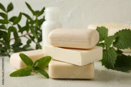 Concept of personal hygiene with natural soap on beige table