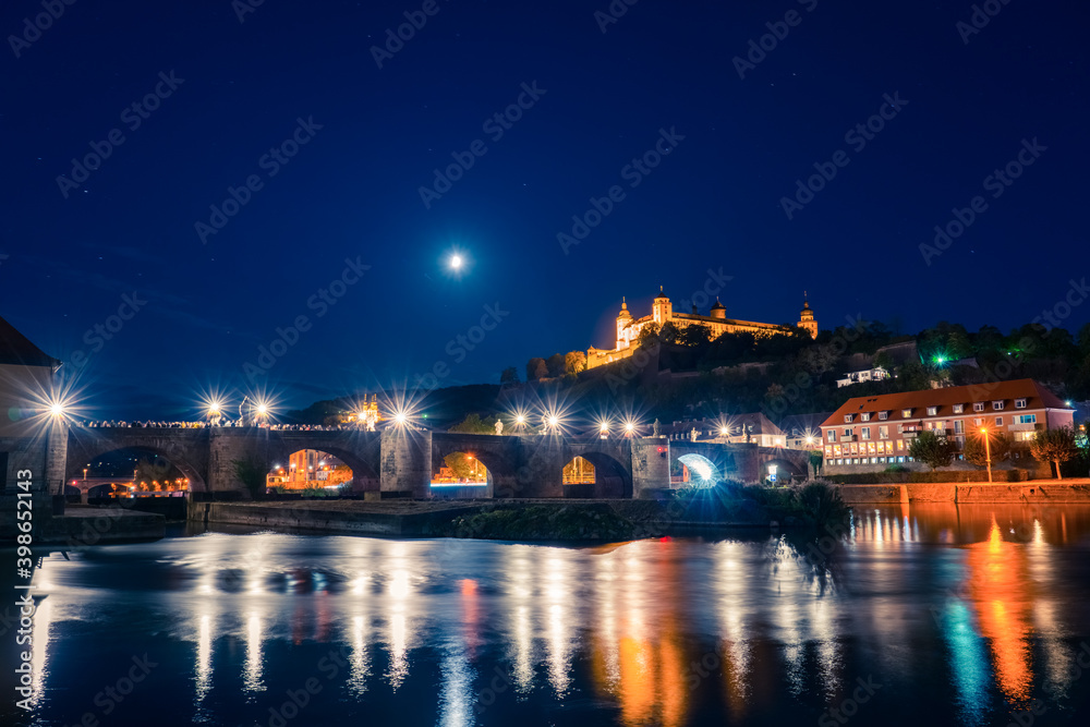 Evening view of Wurzburg in Bavaria, Germany, view of the Marienberg Fortress and old bridge at the Main River 