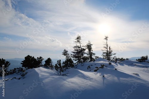 Winter mountain views on red ridge trail from Certovica - Sedlo za Lenivou - Sedlo Homolka during snowshoe tours in Low Tatras in Slovakia