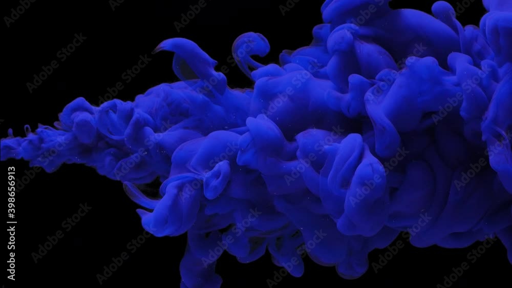 abstract background dense thick cloud of blue colored paint,ink jet breaks into the water on black, underwater explosion