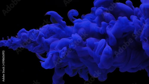 abstract background dense thick cloud of blue colored paint,ink jet breaks into the water on black, underwater explosion