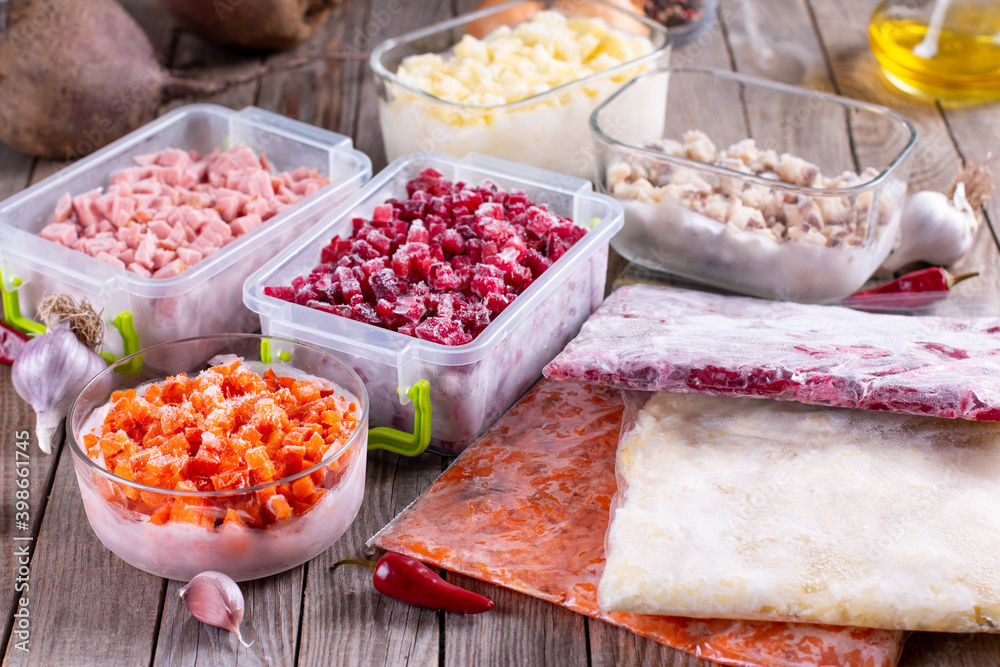 Frozen vegetables in containers on the table. Ready meals. Frozen vegetables in containers on the table. Ready meals.