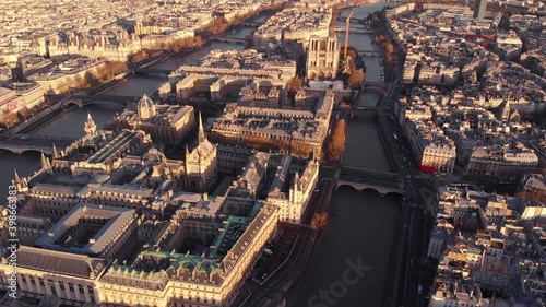 Parisian Notre-Dame on the river Seine and Montparnass bathed in sunshine, aerial footage, France