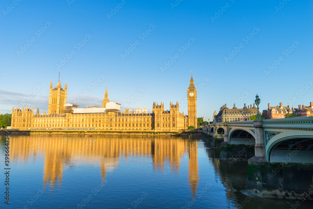 Sunny morning view of British parliament and Elizabeth tower known as Big Ben in London, England