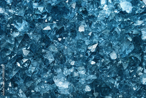 Blue Crystal Mineral Stone.  Macro. Abstract technological background from crystals of a mineral of blue color. photo