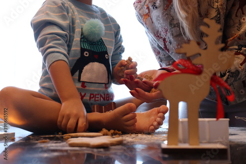 Mother and son making Christmas cookies. Holidays concept photo