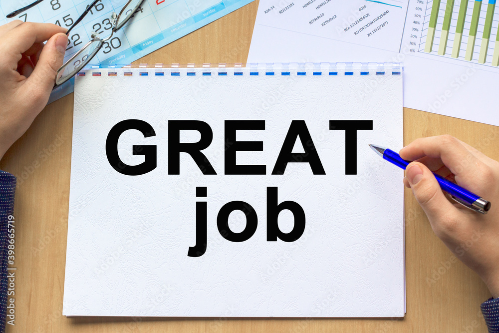 Text GREAT JOB on financial tables with . Business and financial conzept. the working paper with a diagram. Text GREAT JOB on financial tables with . Business and financial conzept. the working paper with a diagram.