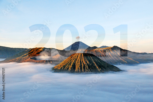 Happy new year 2021 on nature scene of bromo mountain with sunset light in indonesia , Concept new day success , goal , target 