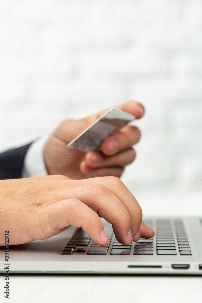 Man trying to pay bills from card Man trying to pay bills from card
