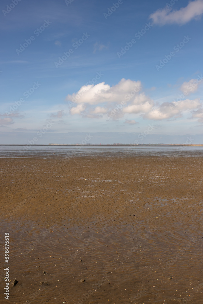 North Sea beach with mud flats at low tide