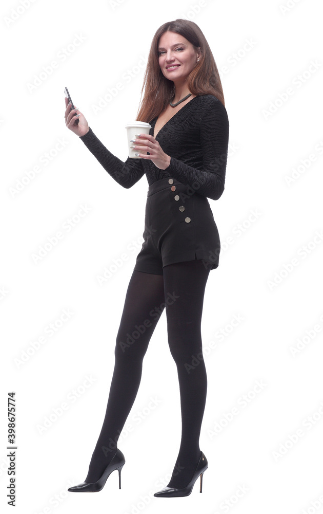 young woman with takeaway coffee reading SMS on her smartphone. young woman with takeaway coffee reading SMS on her smartphone.