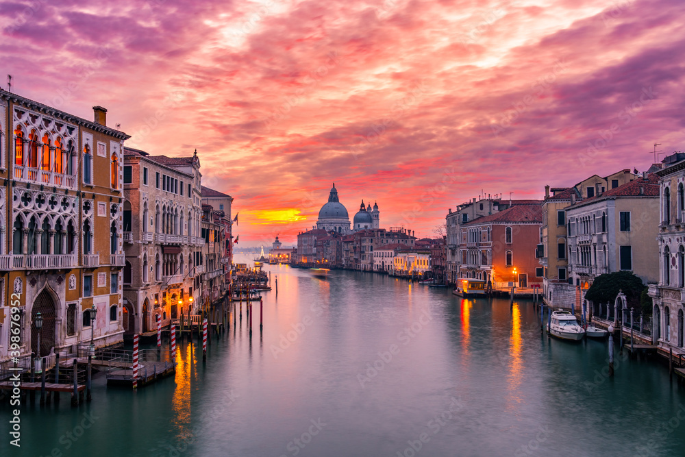 Beautiful sunset view of Grand Canal and Basilica Santa Maria della Salute in Venice, Italy