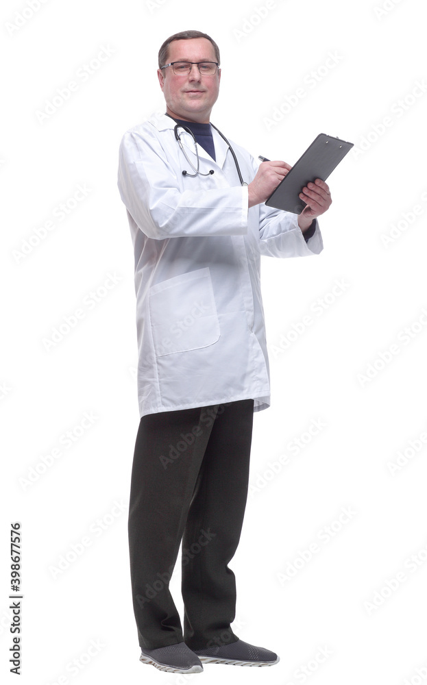 in full growth. doctor with a stethoscope taking notes in the clipboard. in full growth. doctor with a stethoscope taking notes in the clipboard.
