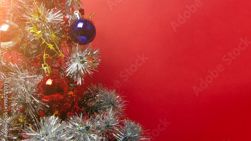 Christmas tree with toys  balls  garlands and lights  new year background. Copy space. Place for text