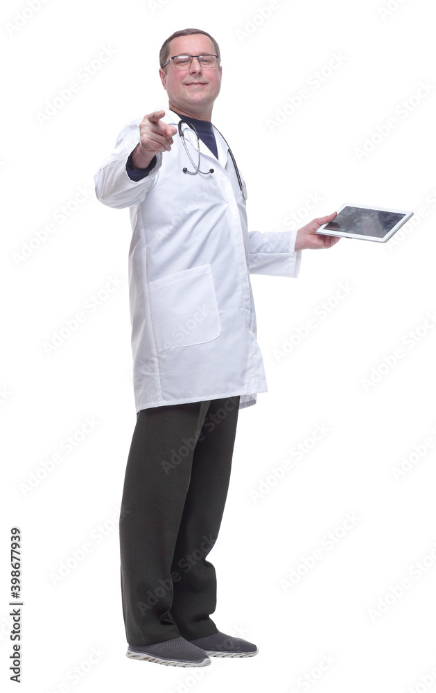 in full growth. friendly doctor with a digital tablet looking at you. in full growth. friendly doctor with a digital tablet looking at you.
