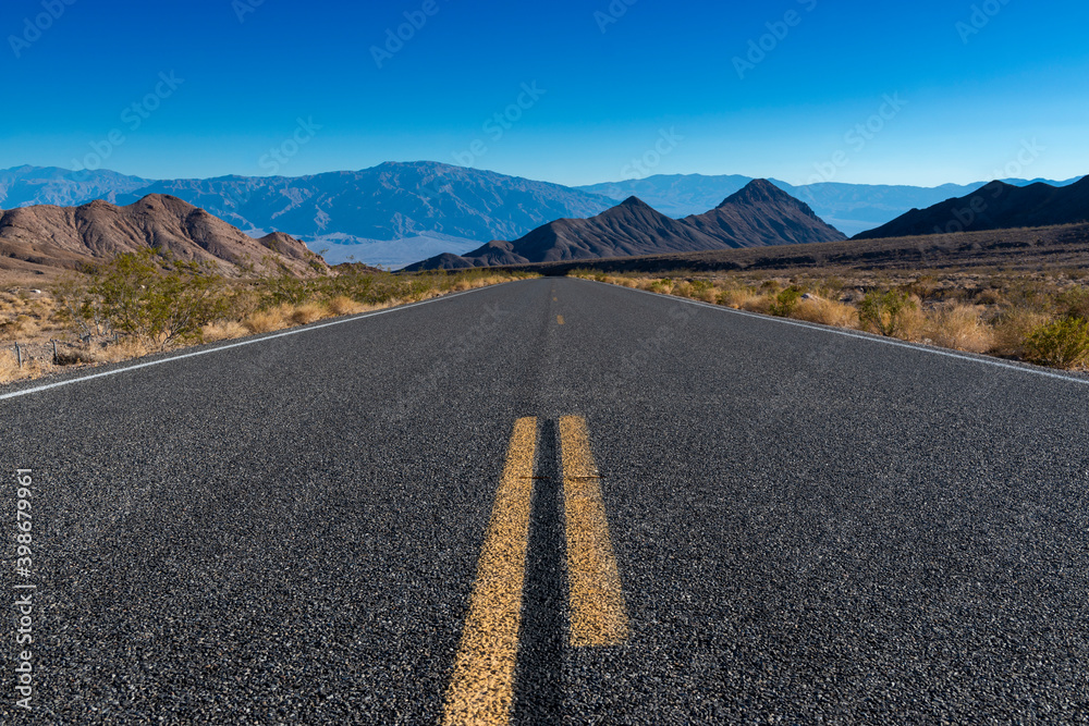 View of an empty road leading to the Death Valley, in Californe, USA.