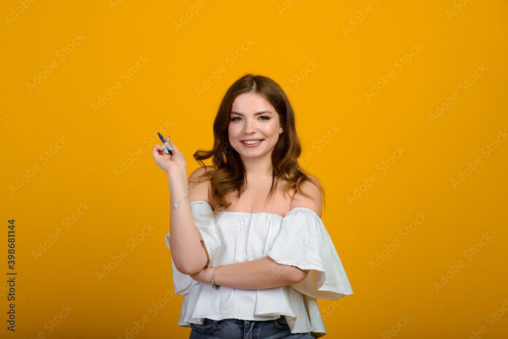 Cheerful young female in formal wear holding pen and smiling Cheerful young female in formal wear holding pen and smiling