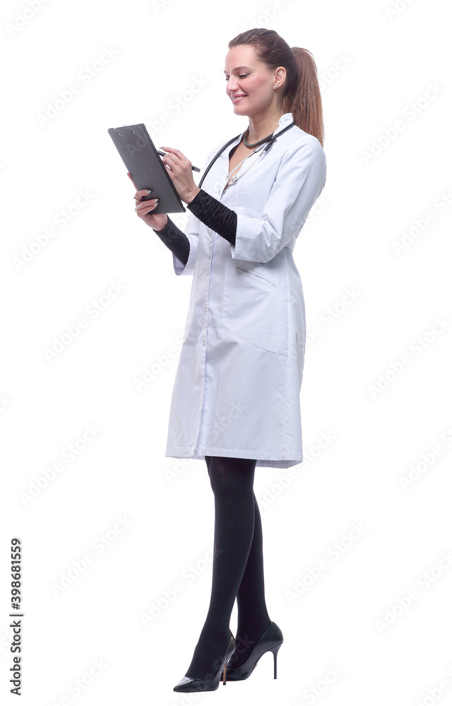 in full growth. smiling woman doctor making notes in the clipboard. in full growth. smiling woman doctor making notes in the clipboard.
