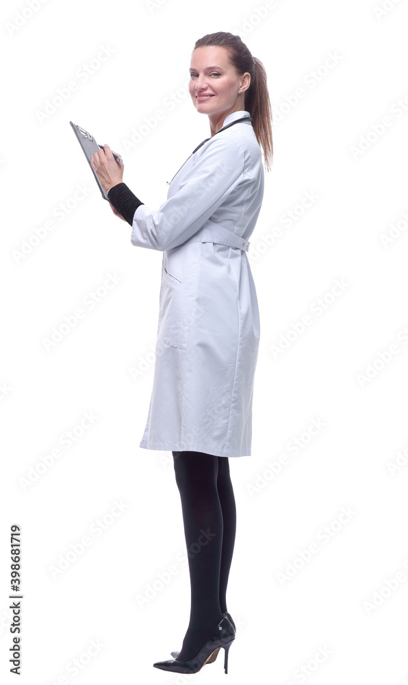 side view. young woman doctor making notes in clipboard. side view. young woman doctor making notes in clipboard.