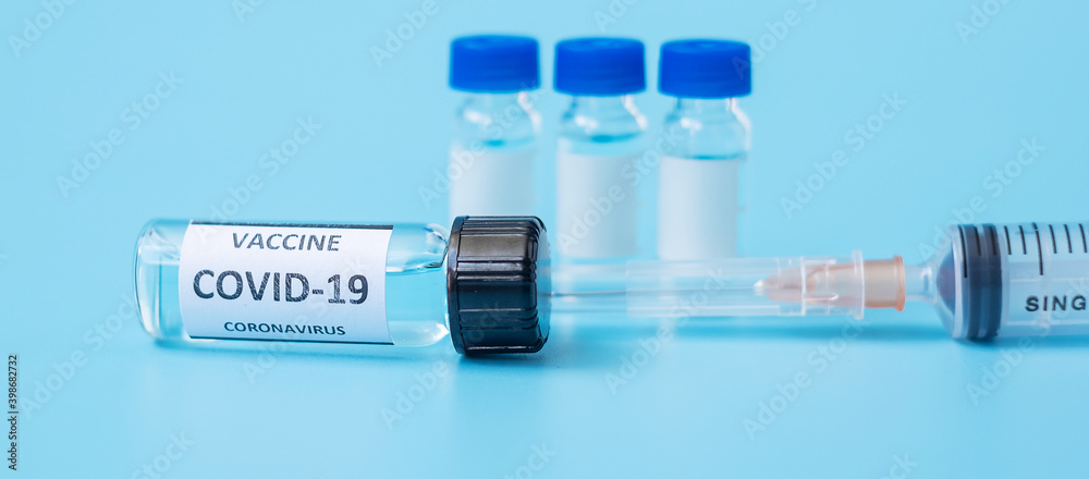 COVID-19 Vaccine vial and injection Needle Syringe against Coronavirus infection in hospital laboratory. Medical, health, Vaccination and immunization concept COVID-19 Vaccine vial and injection Needle Syringe against Coronavirus infection in hospital laboratory. Medical, health, Vaccination and immunization concept