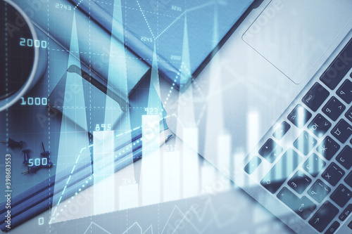 Double exposure of forex graph drawing over desktop background with computer. Concept of financial analysis. Top view.