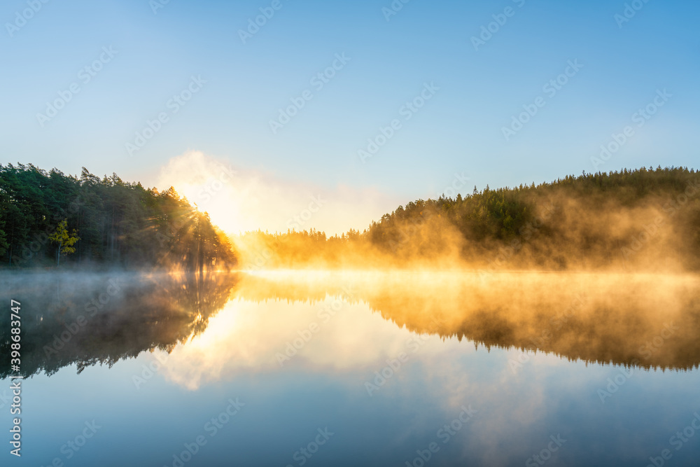 Sunrsise at the lake with morning fog