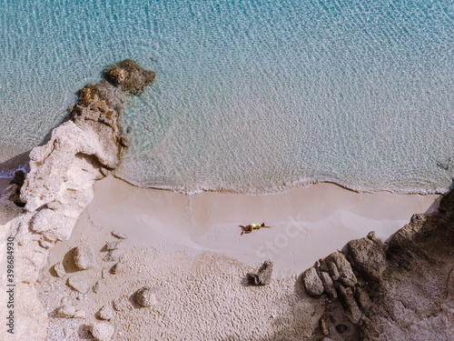 Tropical beach of Voulisma beach, Istron, Crete, Greece ,Most beautiful beaches of Crete island -Istron bay near Agios Nikolaos young couple mid age on vacation in Greece Crete photo