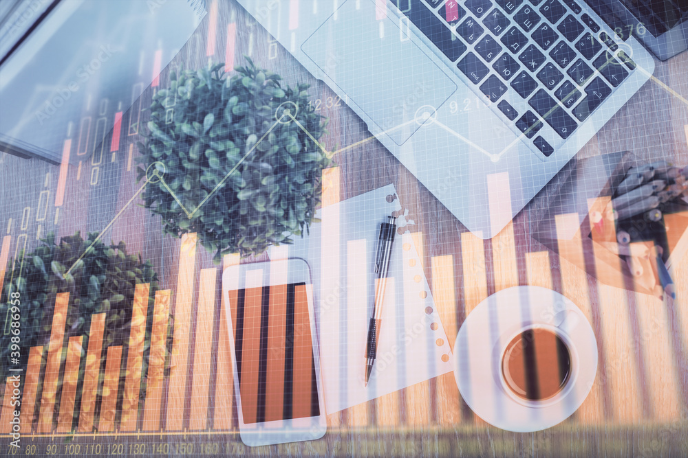 Multi exposure of financial chart hologram over desktop with phone. Top view. Mobile trade platform concept.