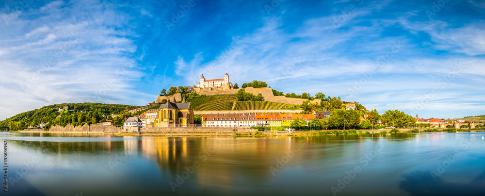 Skyline panorama of Wurzburg with Marienberg Fortress and reflection of the city in Main River. Germany