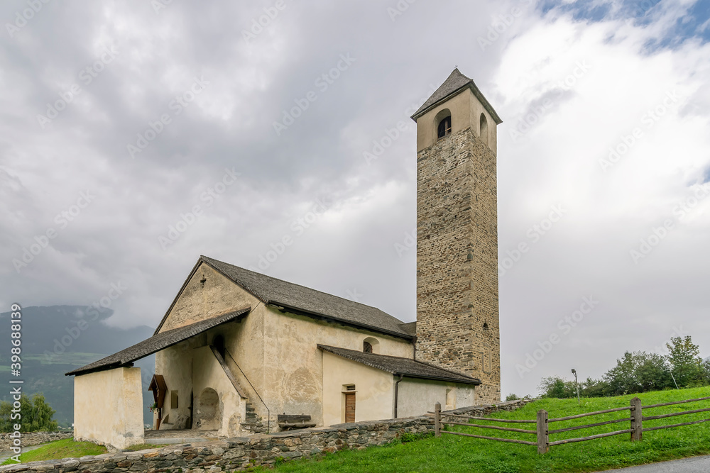 Naklejka premium The ancient Church of San Giovanni in Prato allo Stelvio, South Tyrol, Italy