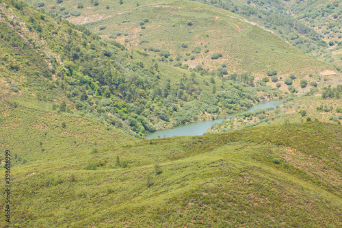 Top view of Monfrague national park in Spain. High mountains and hills covered in green, trees, moss photo