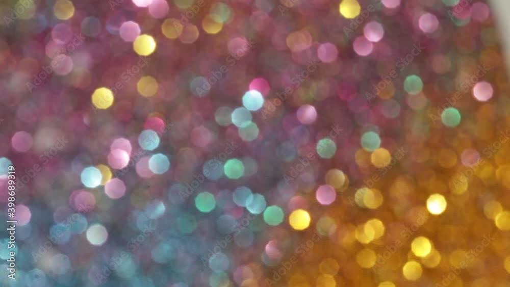 Motley glitter glow background.Shiny multicolored glitter background. Variegated bokeh texture.New Year and Christmas background. Motley glitter glow background.Shiny multicolored glitter background. Variegated bokeh texture.New Year and Christmas background.