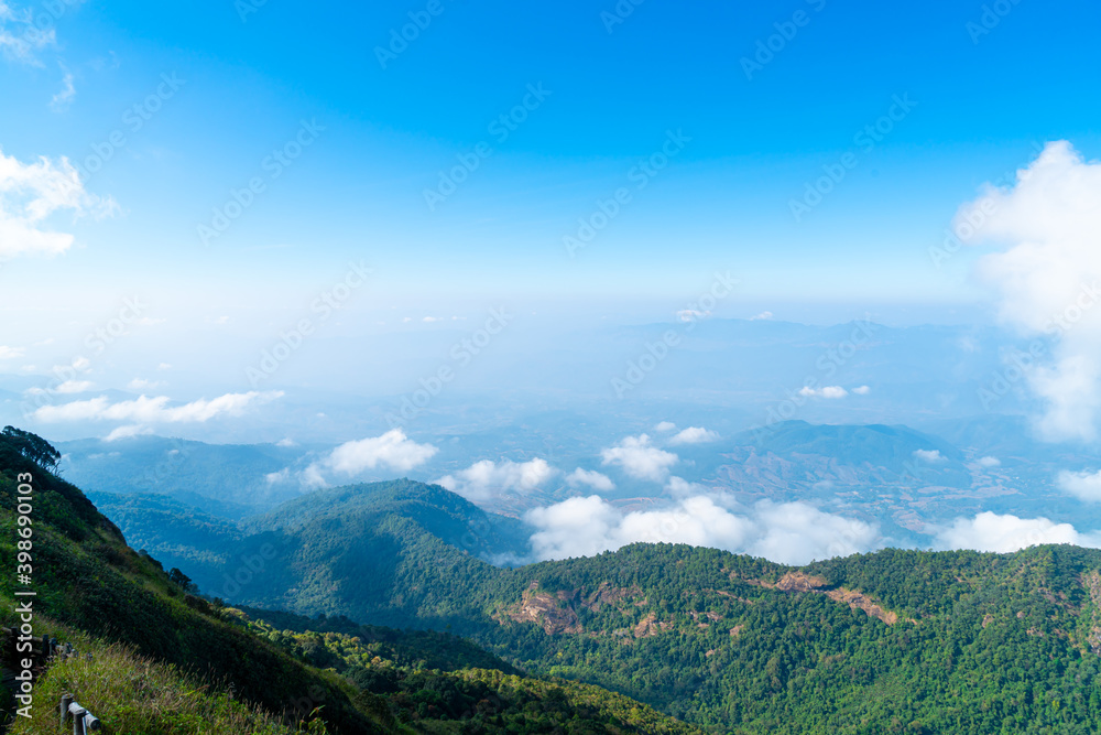beautiful mountain layer with clouds and blue sky