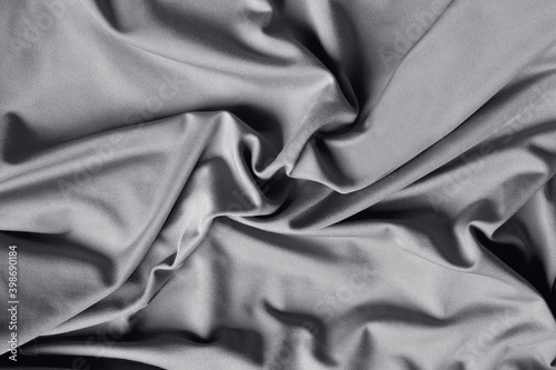 Beautiful Ultimate Grey silk as a background, grey abstraction.