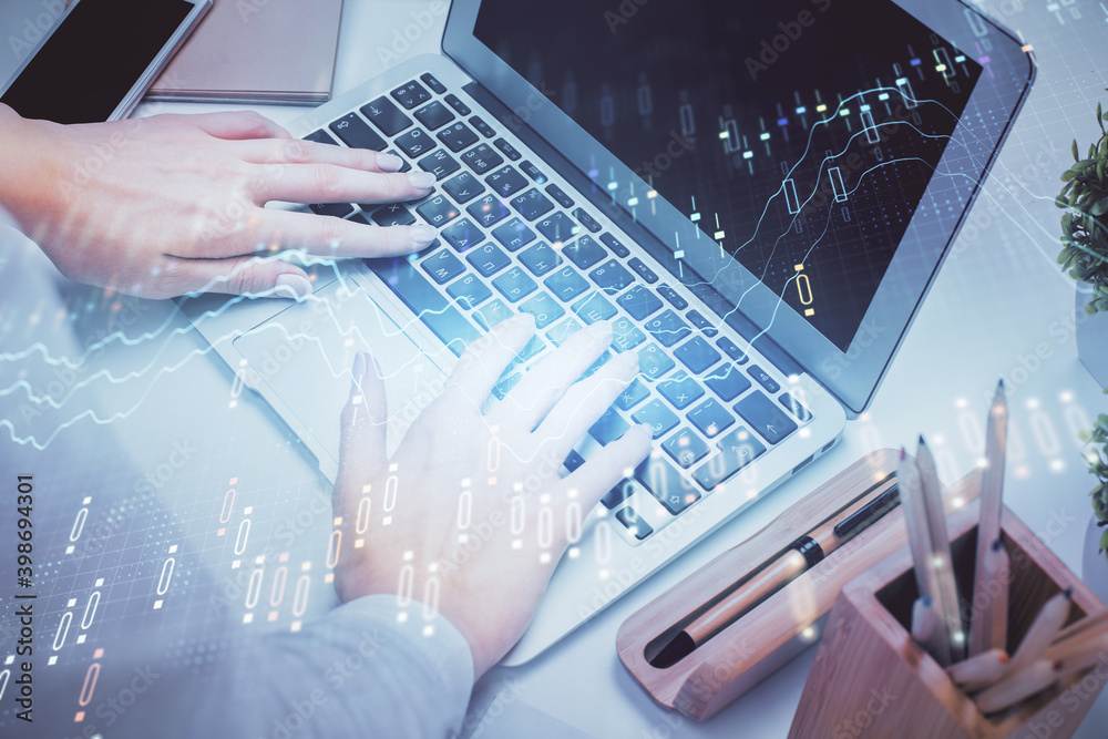 Double exposure of woman hands typing on computer and forex chart hologram drawing. Stock market invest concept. Double exposure of woman hands typing on computer and forex chart hologram drawing. Stock market invest concept.