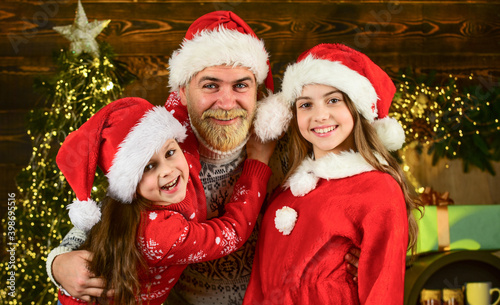 Lovely family at home. Spread love around. Father and little daughters celebrate new year. Christmas becomes special with children. Christmas eve concept. Christmas spirit. Dad kids having fun