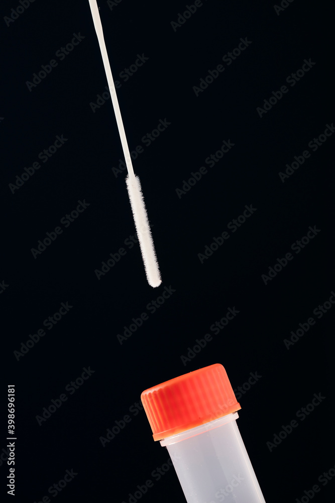 SARS COV-2 antigen detection test, swab and transport vial, with a dark blue background