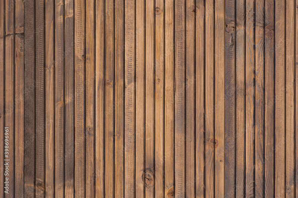 Fine wood background in dark brown tone. in vertical position. texture and detail of wood fence. A fine detail background for abstract design. Wooden brown background. Smooth and polished wood Fine wood background in dark brown tone. in vertical position. texture and detail of wood fence. A fine detail background for abstract design. Wooden brown background. Smooth and polished wood