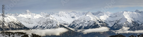 Dramatic snow covered mountains Landscape. Amazing Panoramic snowy winter landscape in Alps at sunrise morning. View from Riedberger Horn Grasgehren Ski Resort to Allgau Alps, Bavaria, Germany. © Drepicter