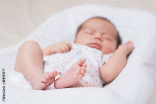 Little foot of a cute, adorable newborn girl