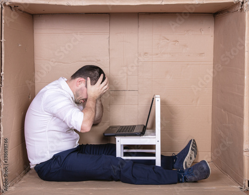 Φωτογραφία broken businessman in a cardboard office, stress and depression from overwork