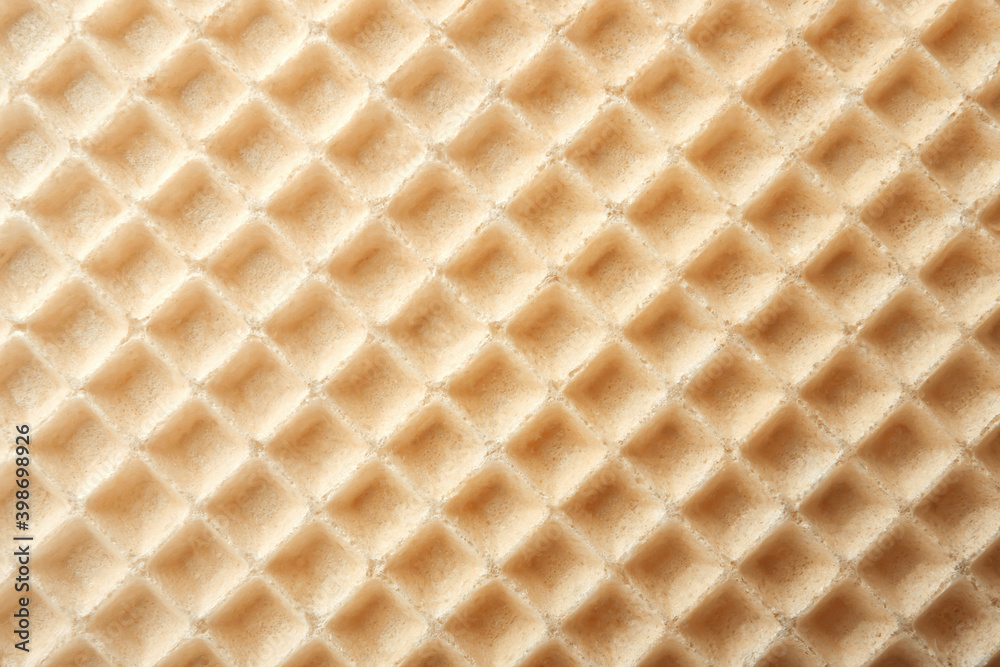 Empty wafer texture as background. Closeup view of golden waffle. Top view Empty wafer texture as background. Closeup view of golden waffle. Top view