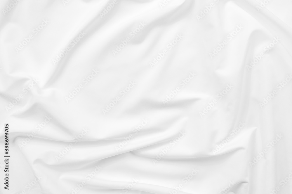 Abstract white fabric texture background. Cloth soft wave. Creases of satin. silk and cotton.