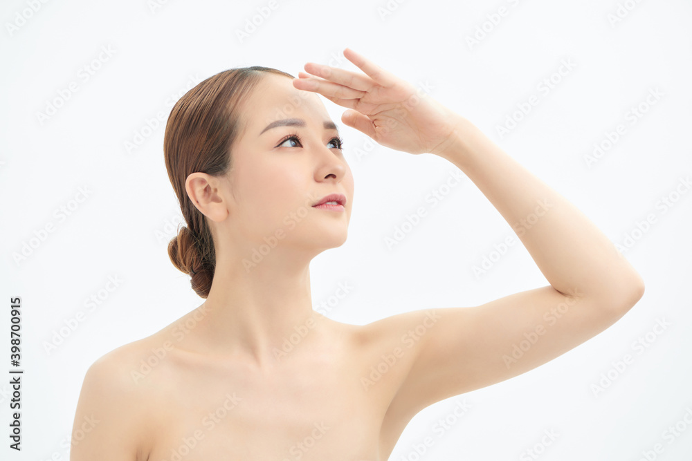 Young Asian woman looking up and showing hand to cover the light. Young Asian woman looking up and showing hand to cover the light.