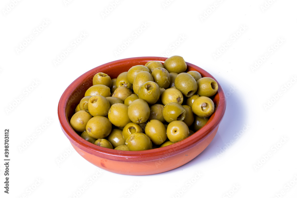 Olives stuffed with anchovies in a ceramic bowl and white background Olives stuffed with anchovies in a ceramic bowl and white background